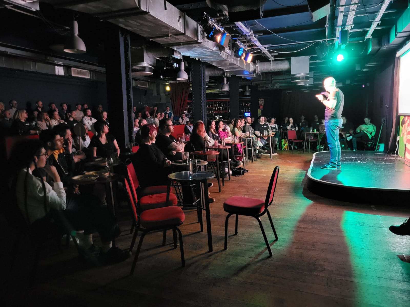 Lorimer Moseley addresses a crowd at Newcastle Comedy Club